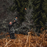 Man throwing clay pigeons