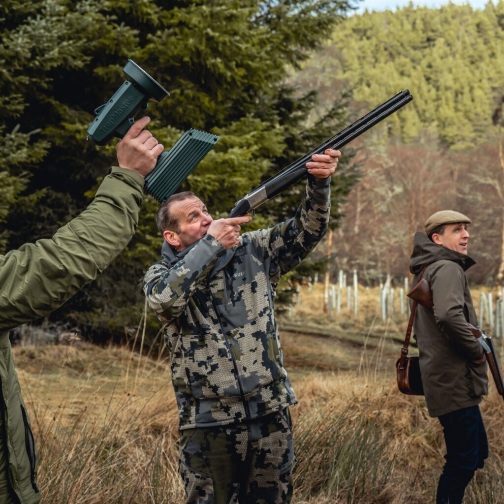 Man shooting clay pigeons