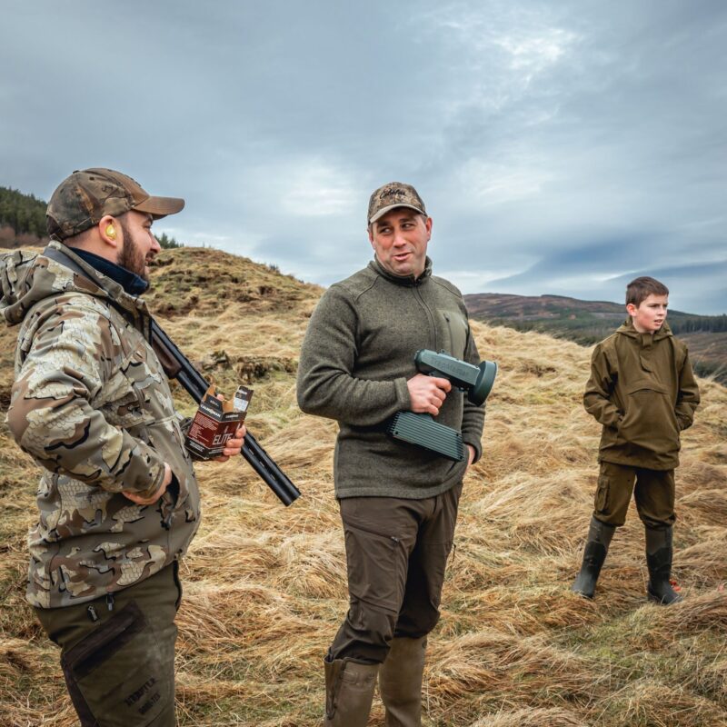 Men talking while shooting clay pigeons