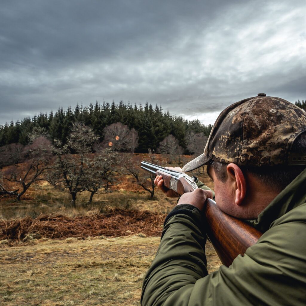 Man shooting clay pigeons